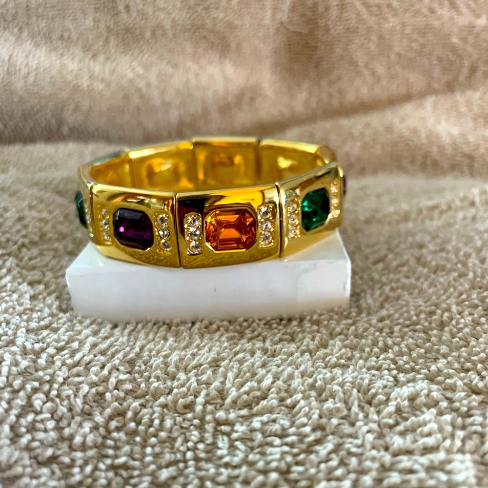 Joan Rivers gold tone stretch bracelet with multi colored crystal stones.